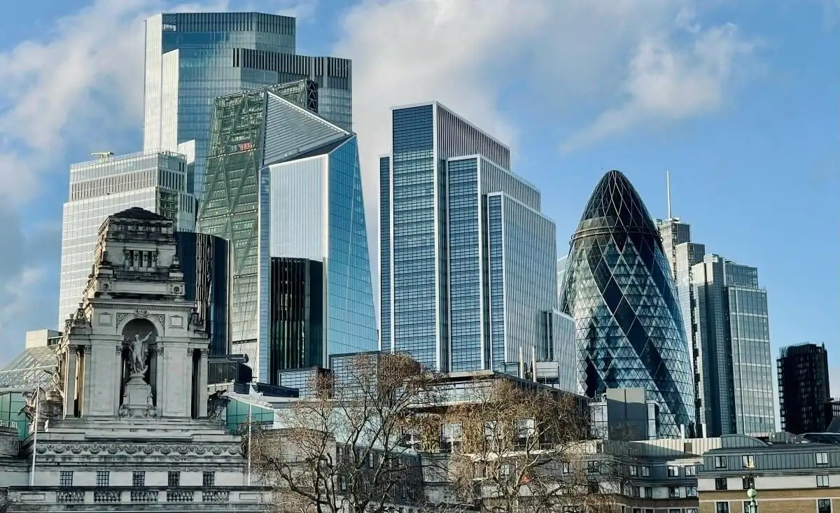 London cityscape featuring modern skyscrapers and historic landmarks.