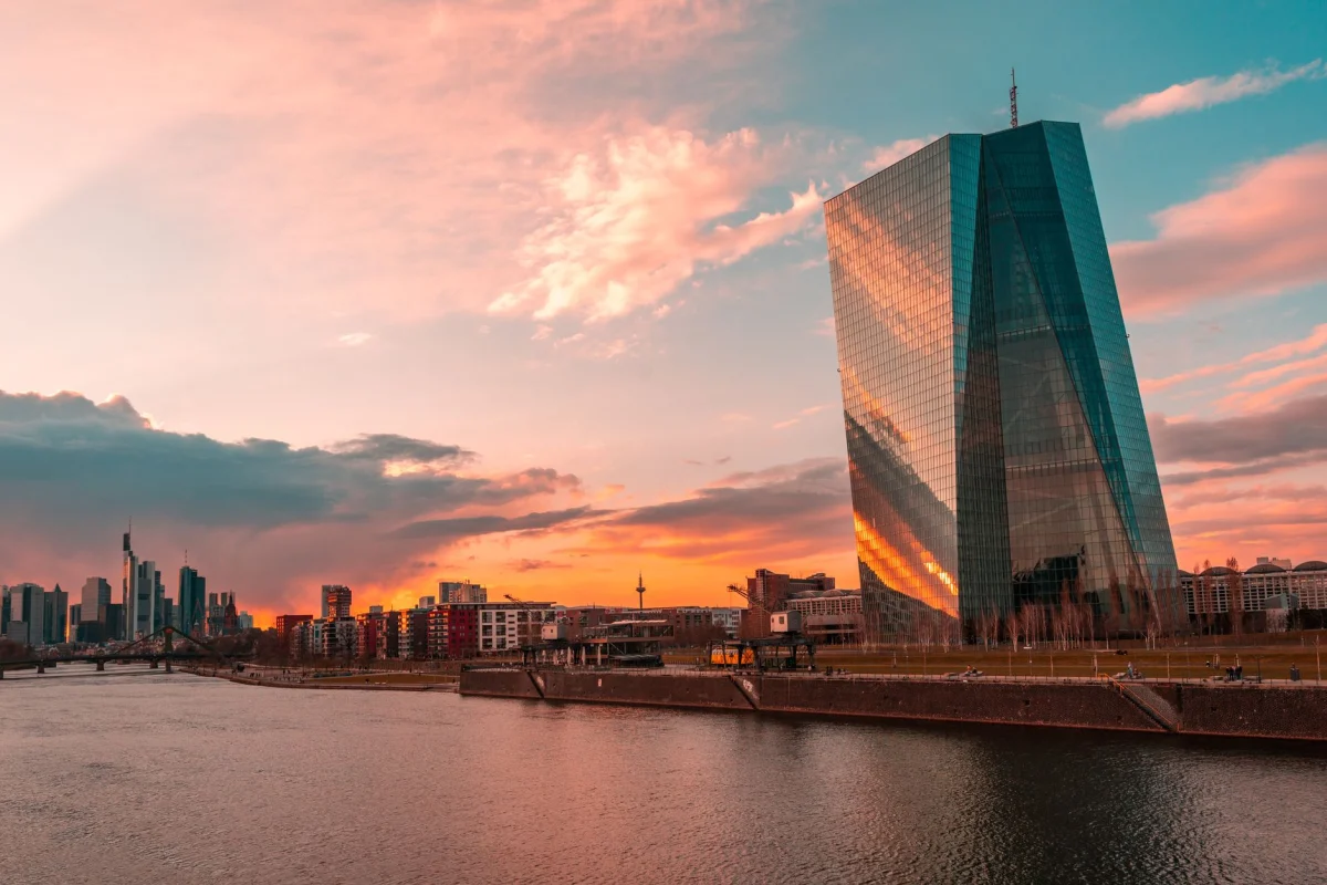 Stunning sunset over Frankfurt's skyline featuring the iconic ECB Tower and Main River.